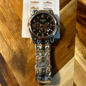 Oruss 1853 men’s watch this watch is stainless steel and is new with tags.